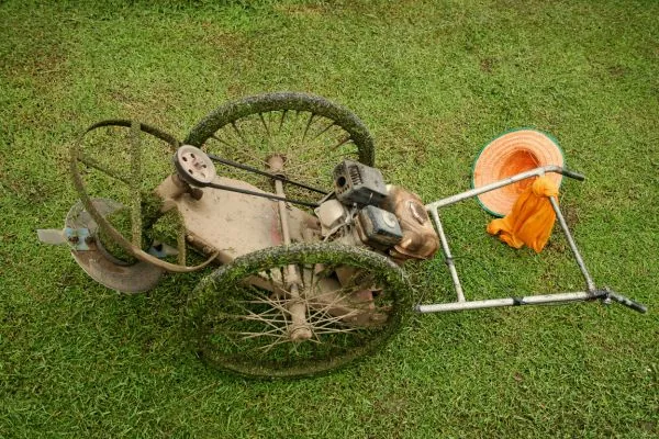 cutting grass old fashioned lawn mower 