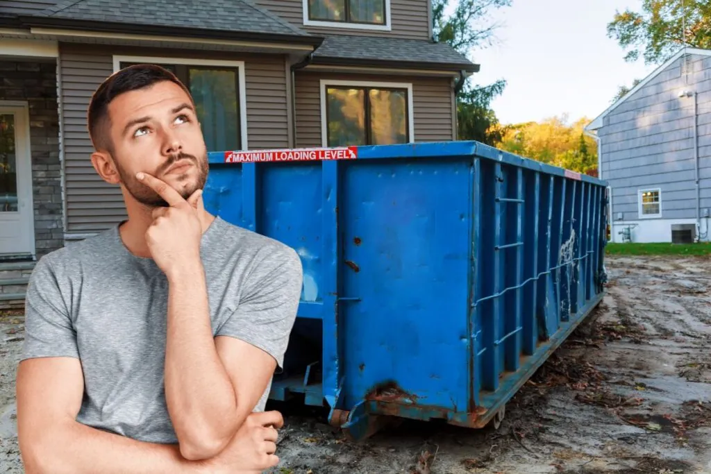 a man thinking on how much does yard dumpster cost?