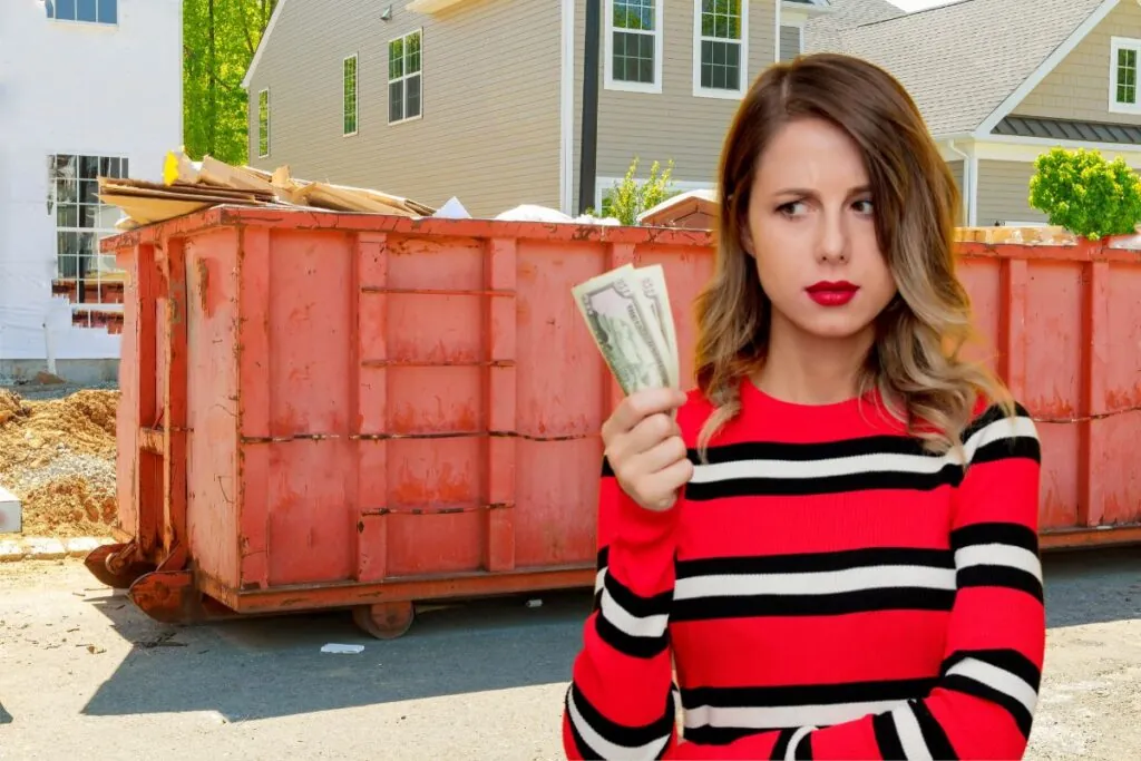 a woman holding a dollar is thinking of the 20 yard dumpster cost